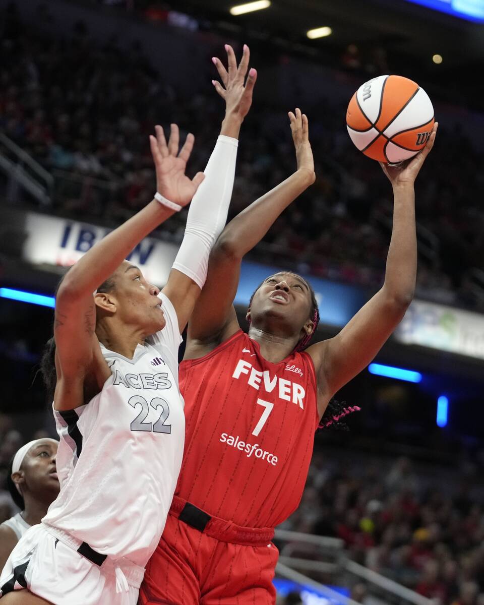 Indiana Fever's Aliyah Boston (7) shoots over Las Vegas Aces' A'ja Wilson (22) during the first ...