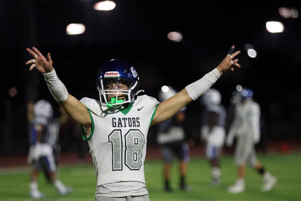 Green Valley’s Roman Adams (18) celebrates during the second half of a high school footb ...