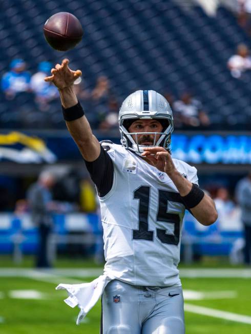 Raiders quarterback Gardner Minshew (15) tosses a pass as they warm up to face the Los Angeles ...