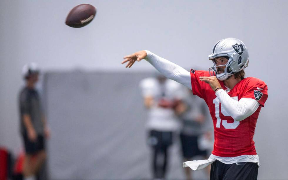 Raiders quarterback Gardner Minshew (15) tosses a pass during practice at the Intermountain Hea ...