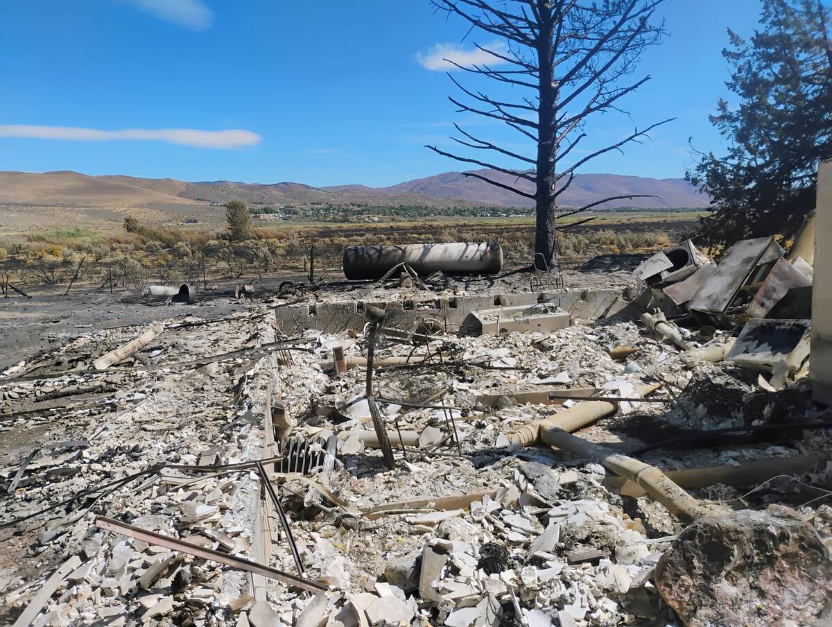 The damage to JoAnna Warthan's family home in Washoe Valley caused by the Davis Fire is seen in ...