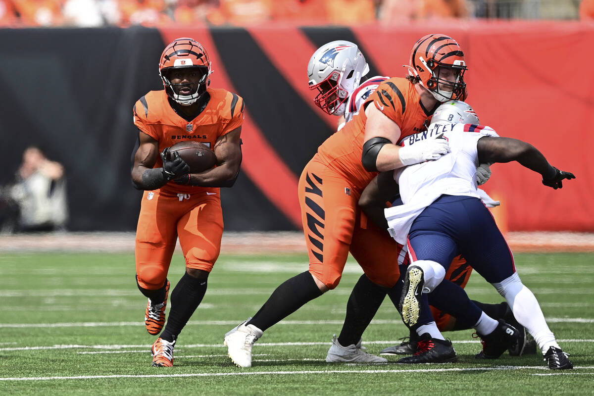 Cincinnati Bengals running back Zack Moss (31) carries the ball during an NFL football game aga ...