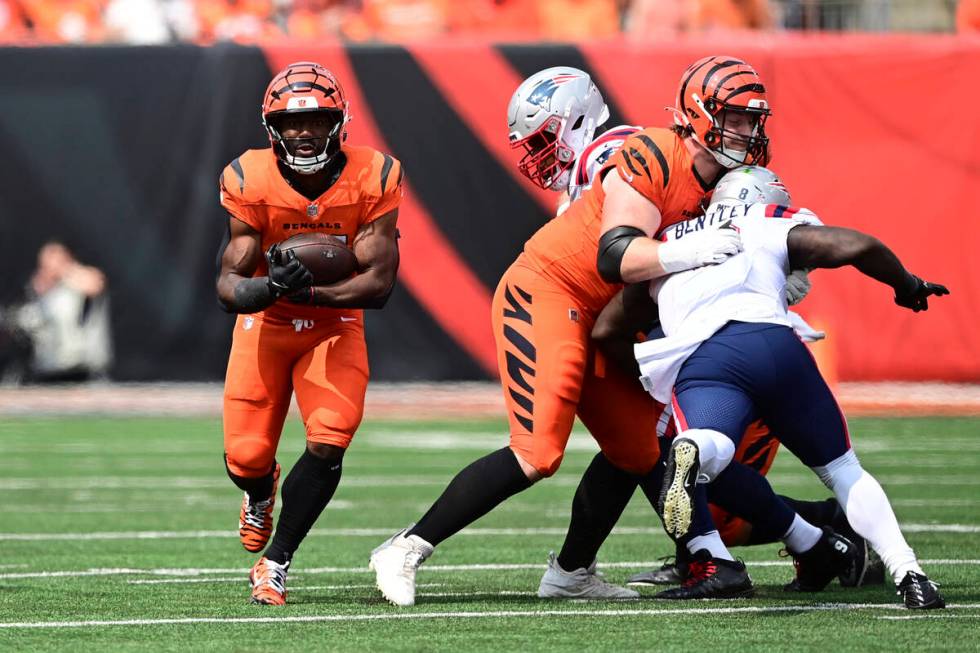 Cincinnati Bengals running back Zack Moss (31) carries the ball during an NFL football game aga ...