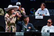 Fighters Ronaldo Rodriguez, left, talks about his opponent as Daniel Zellhuber reacts during th ...