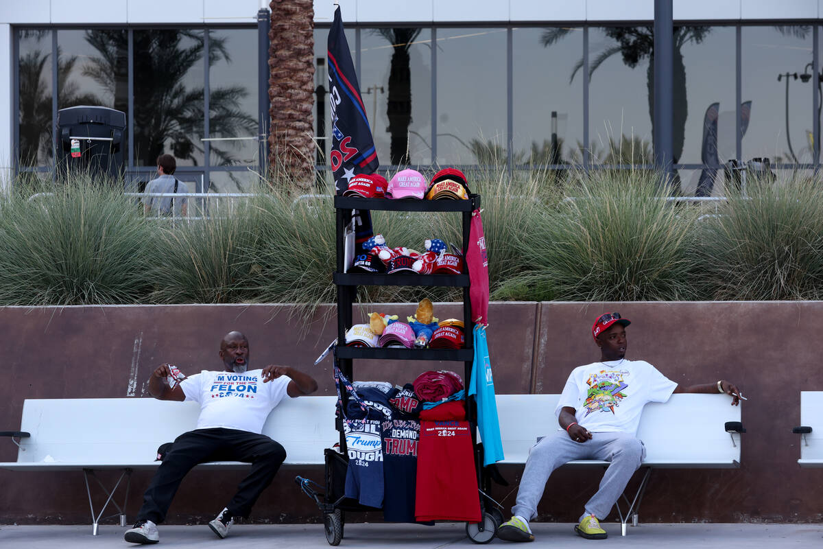 Merchandise sellers advertise their product before former US President and Republican president ...