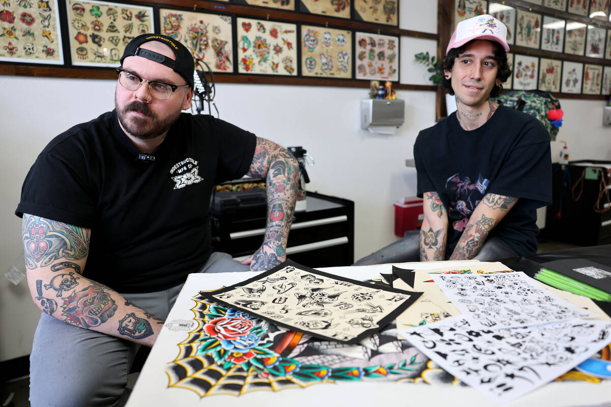 Pete Mills, left, and Franco Adonis who call themselves tattooers, talk about the shop’s ...