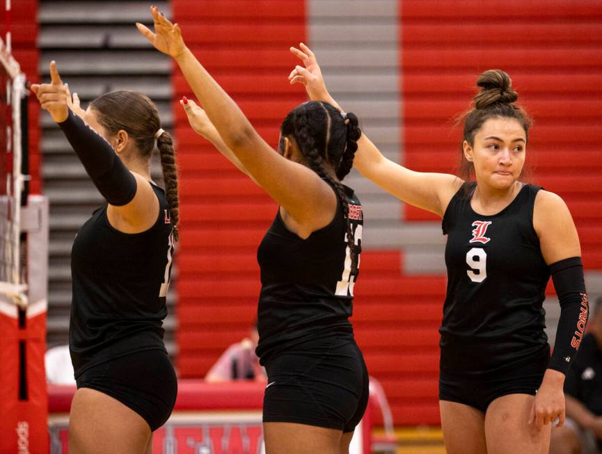 Liberty junior Myla Matavao (9) prepares for a serve during the high school volleyball game aga ...