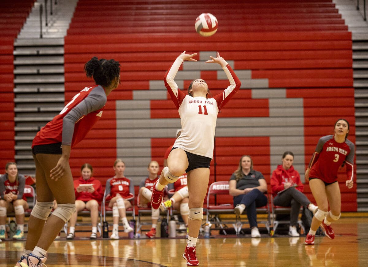 Arbor View junior Lauryn Brenner (11) sets the ball during the high school volleyball game agai ...