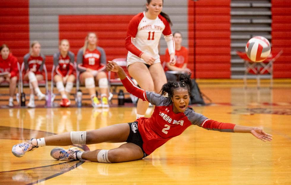 Arbor View junior Cameron Reese (2) dives for the ball during the high school volleyball game a ...