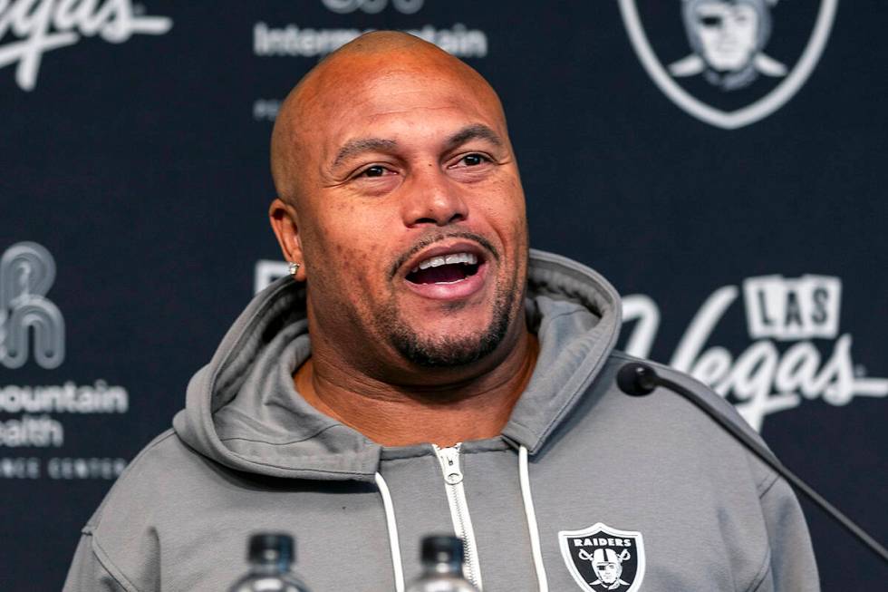 Raiders head coach Antonio Pierce answers a question during a media interview before practice a ...