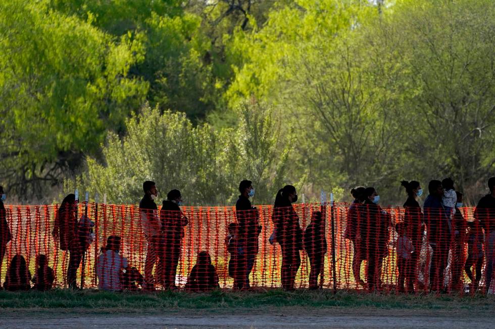 In this March 19, 2021, file photo, migrants are seen in custody at a U.S. Customs and Border P ...