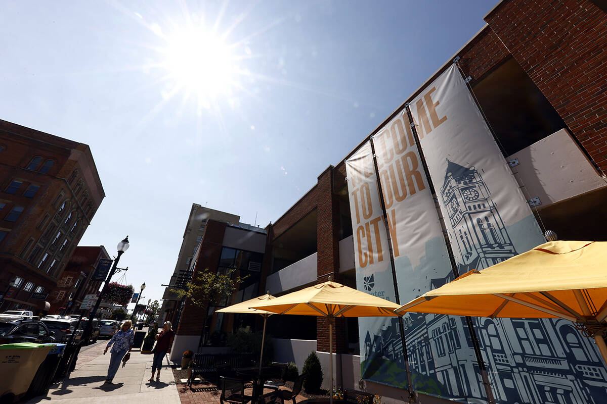 Pedestrians walk down Fountain Avenue in Springfield, Ohio, Wednesday, Sept. 11, 2024. (AP Phot ...