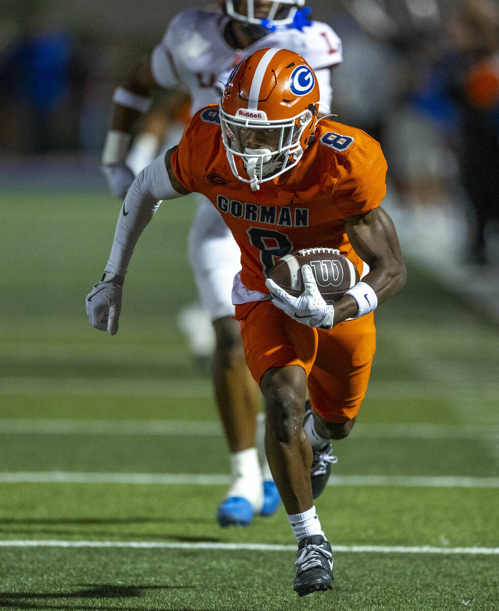 Bishop Gorman wide receiver Greg Toler (8) runs to the end zone after a long touchdown pass ove ...