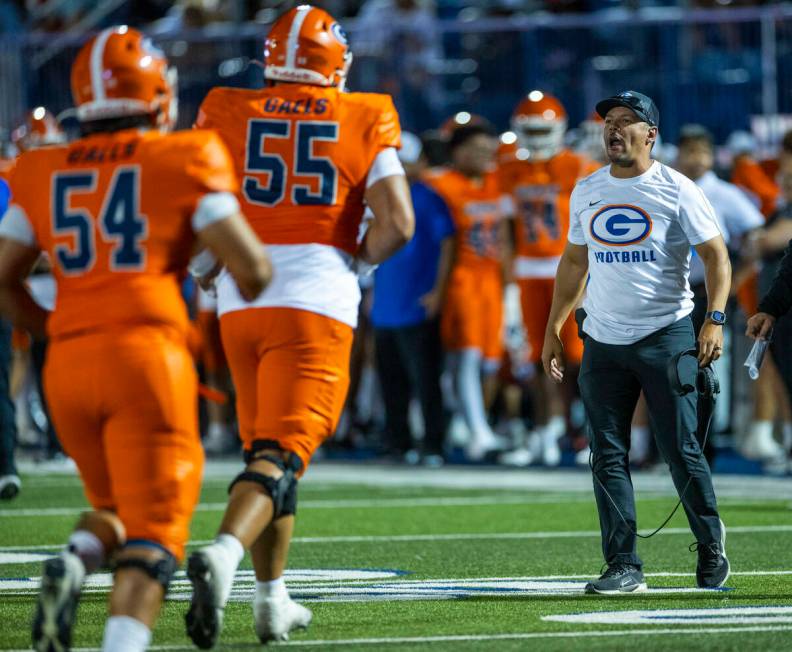 Bishop Gorman head coach Brent Browner yells instructions to his players after a score against ...