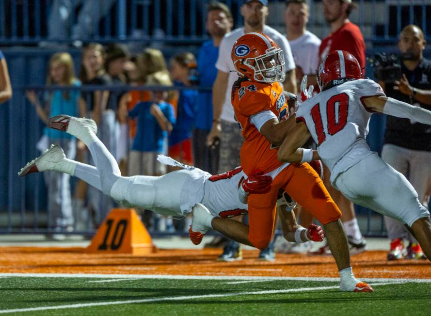 Bishop Gorman running back Myles Norman (24) is caught near the end zone after a long run by Or ...