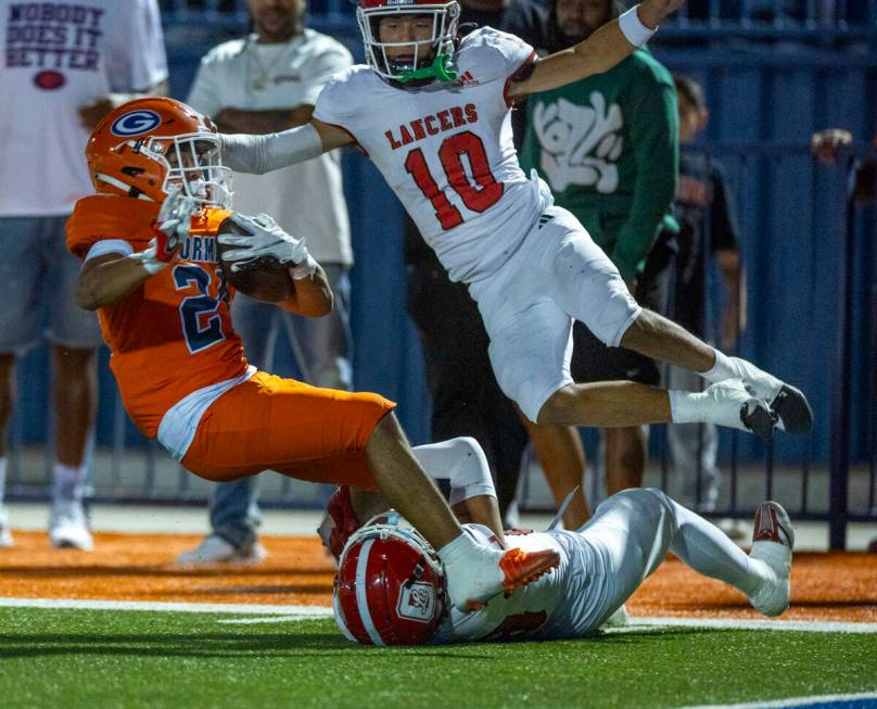 Bishop Gorman running back Myles Norman (24) is caught near the end zone after a long run by Or ...