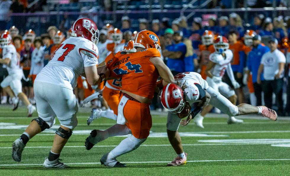 Bishop Gorman defensive lineman Sione Motuapuaka (44) sacks Orange Lutheran quarterback Tj Late ...