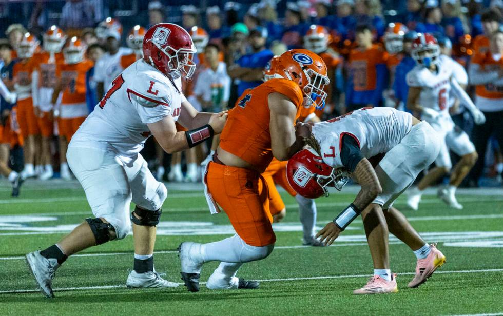 Bishop Gorman defensive lineman Sione Motuapuaka (44) sacks Orange Lutheran quarterback Tj Late ...