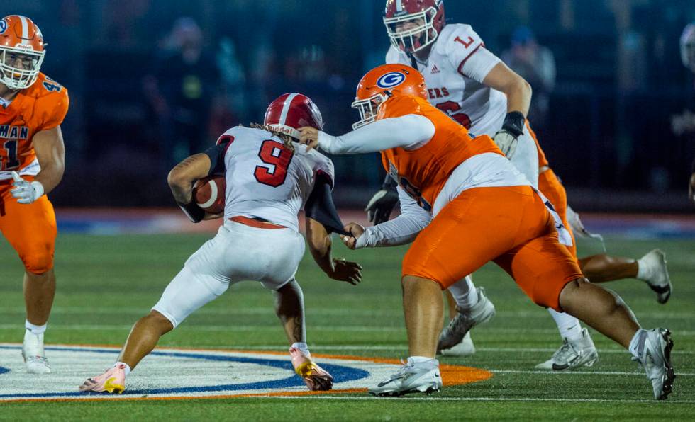 Bishop Gorman defensive lineman Caleb Joy (90) sacks Orange Lutheran quarterback Tj Lateef (9) ...