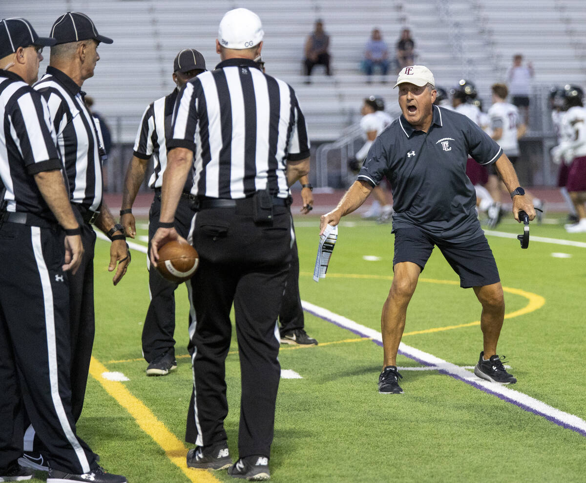 Faith Lutheran Head Coach Michael Sanford yells at the referees after a play was called dead ea ...