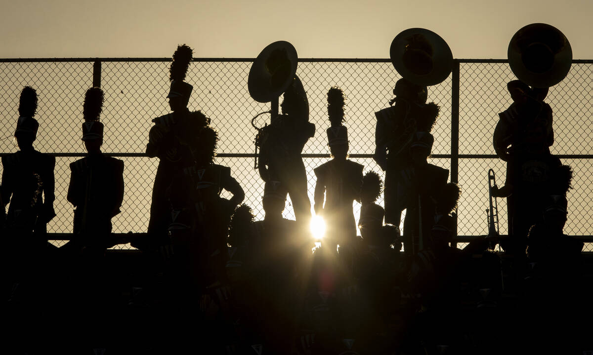 Shadow Ridge Thundering Herd marching band members wait to play in the stands during the high s ...