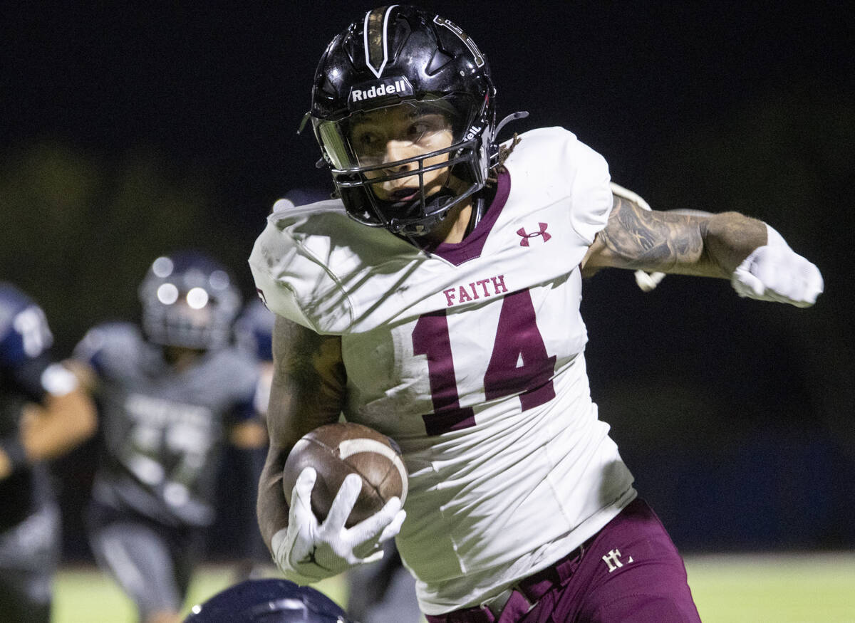 Faith Lutheran senior Cale Breslin (14) runs the ball during the high school football game agai ...