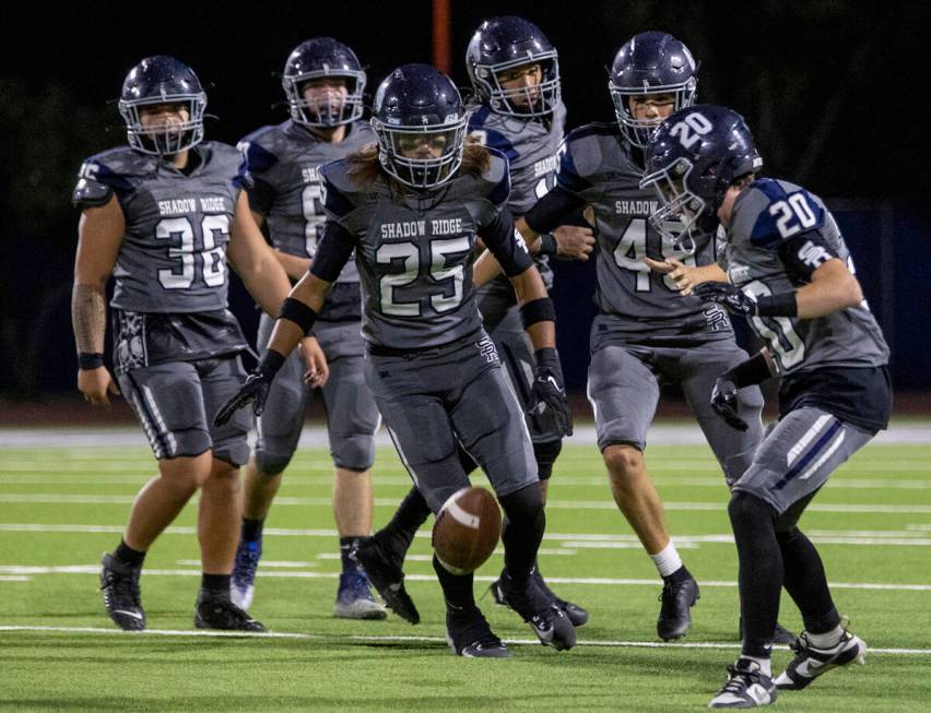 Shadow Ridge players watch a punt come to a stop during the high school football game against F ...