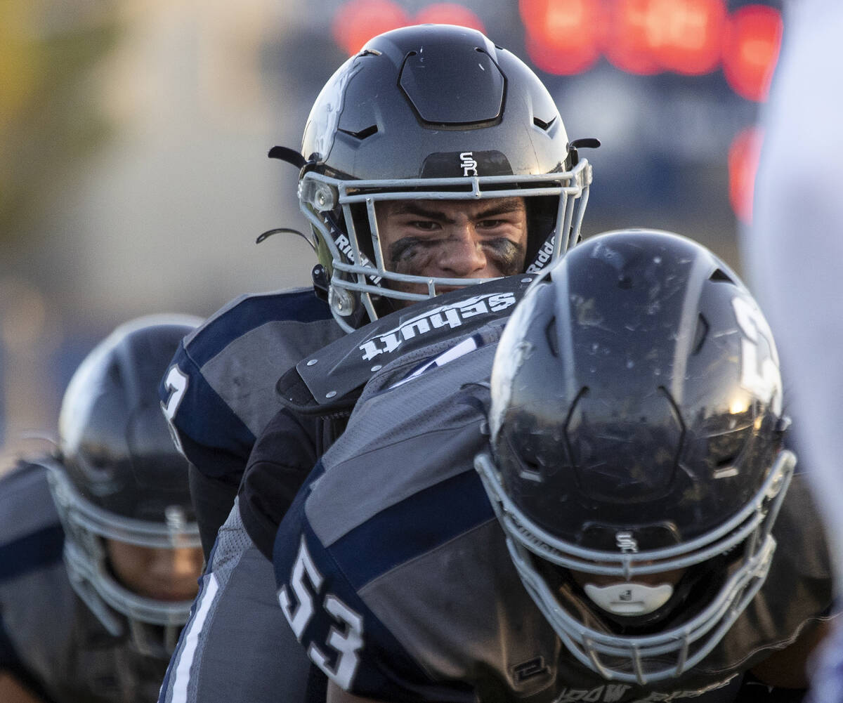 Shadow Ridge quarterback Ula Cox (3) snaps the ball during the high school football game agains ...