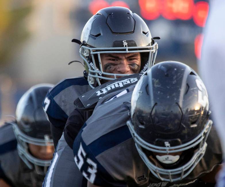 Shadow Ridge quarterback Ula Cox (3) snaps the ball during the high school football game agains ...