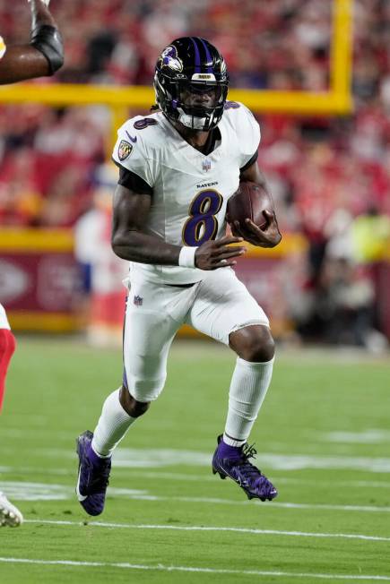 Baltimore Ravens quarterback Lamar Jackson (8) runs against the Kansas City Chiefs during an NF ...