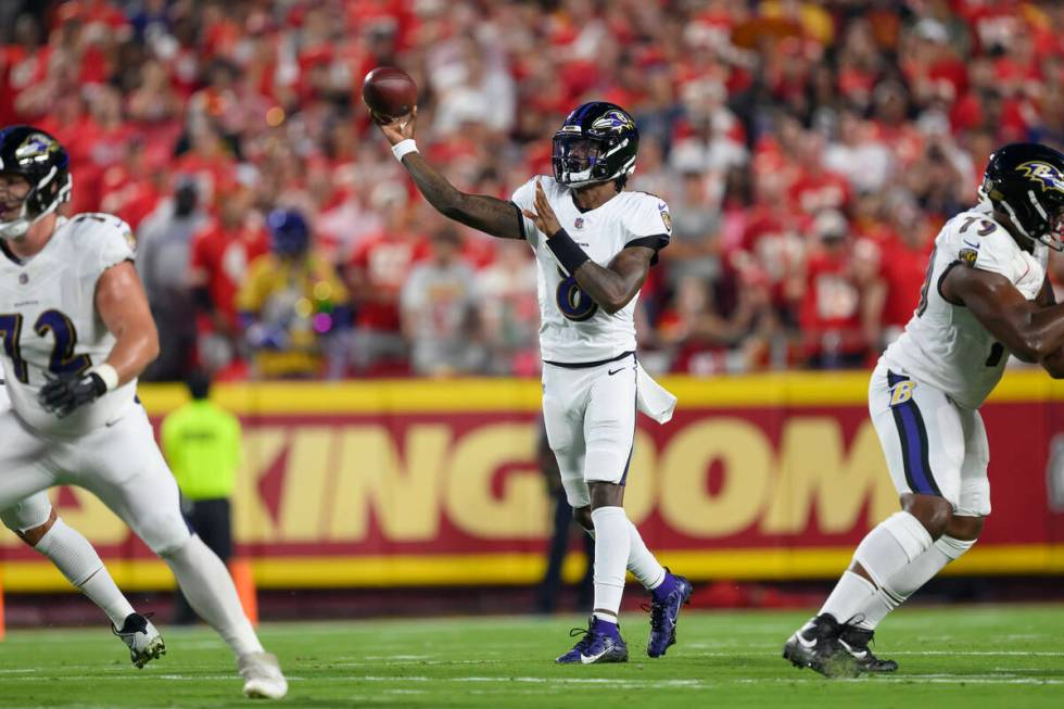 Baltimore Ravens quarterback Lamar Jackson throws during the first half an NFL football game ag ...