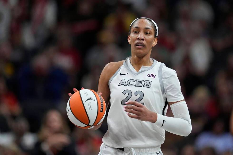 Las Vegas Aces' A'ja Wilson dribbles during the second half of a WNBA basketball game against t ...