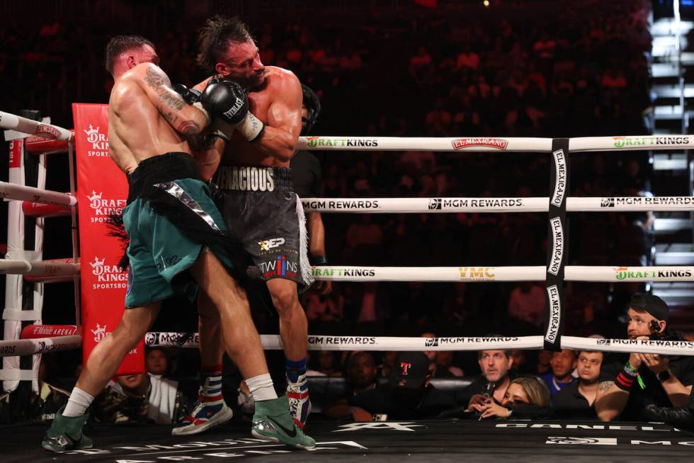 Caleb Plant gets a left on Trevor McCumby during a super middleweight title boxing bout at T-Mo ...