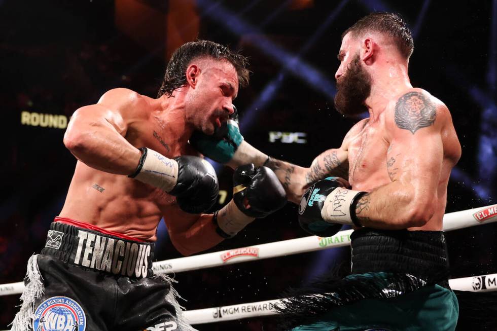 Caleb Plant gets a right on Trevor McCumby during a super middleweight title boxing bout at T-M ...