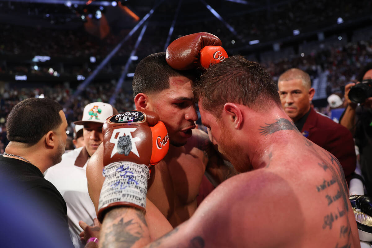 Canelo Alvarez, right, embraces Edgar Berlanga after defeating him in a super middleweight cham ...