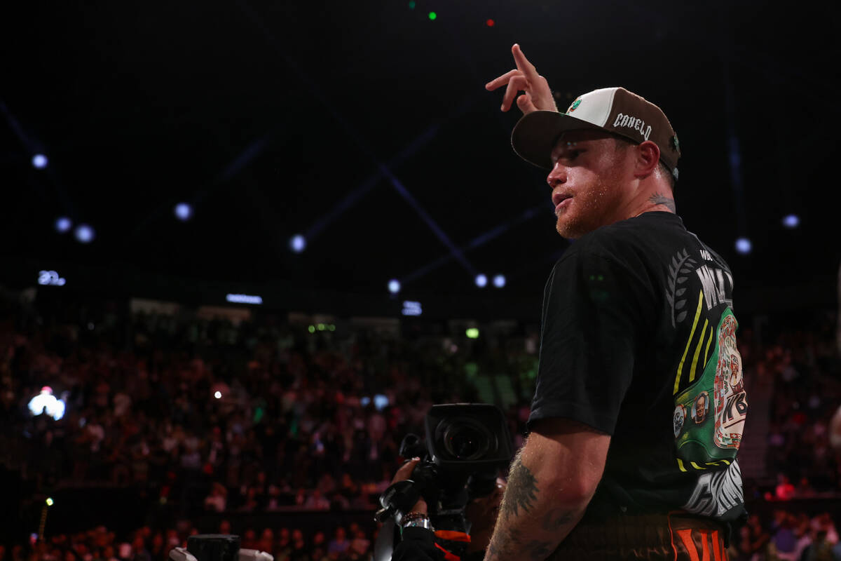 Canelo Alvarez gestures to the crowd after defeating Edgar Berlanga during a super middleweight ...