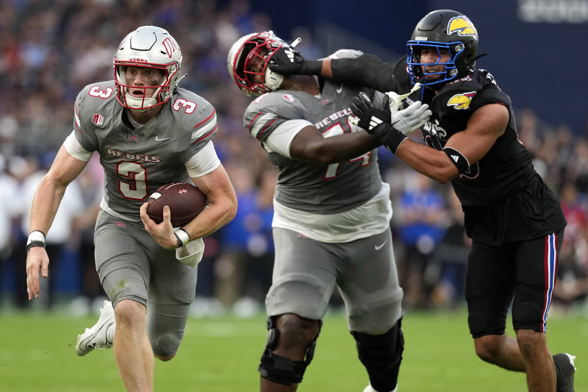 UNLV quarterback Matthew Sluka (3) runs with the ball against Kansas in the first half of an NC ...