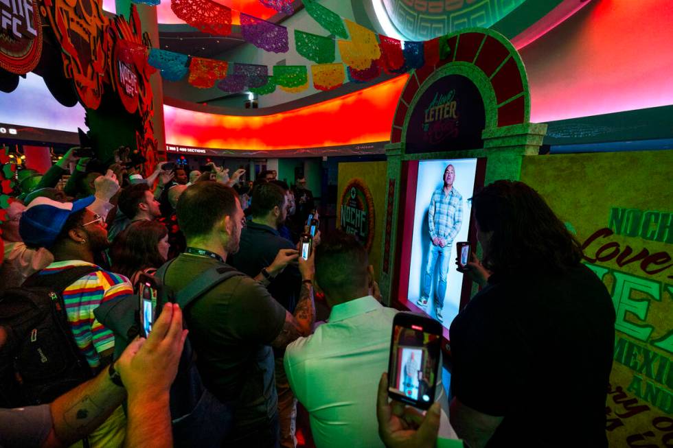 A virtual Dana White is viewed on the main concourse during UFC 306: Riyadh Season Noche at the ...