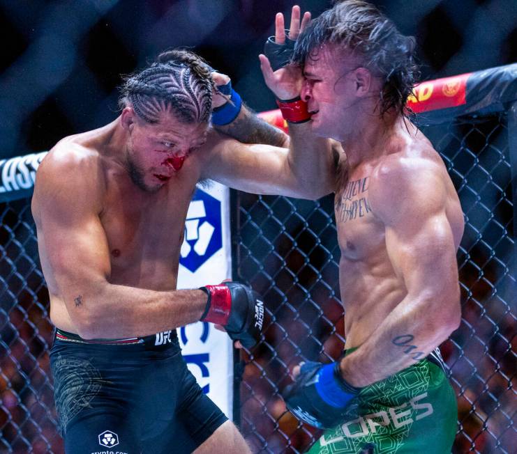 Featherweight Brian Ortega and Diego Lopes trade blows in their fight during UFC 306: Riyadh Se ...