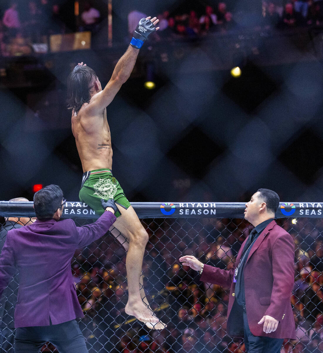 Featherweight Diego Lopes celebrates his win over Brian Ortega trade blows in their fight durin ...