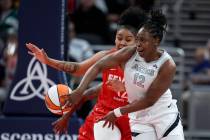 Las Vegas Aces' Chelsea Gray (12) makes a pass against Indiana Fever's Damiris Dantas during th ...