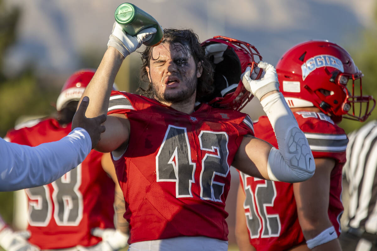 Arbor View linebacker Christian Thatcher (42) sprays water onto his face during the Class 5A hi ...