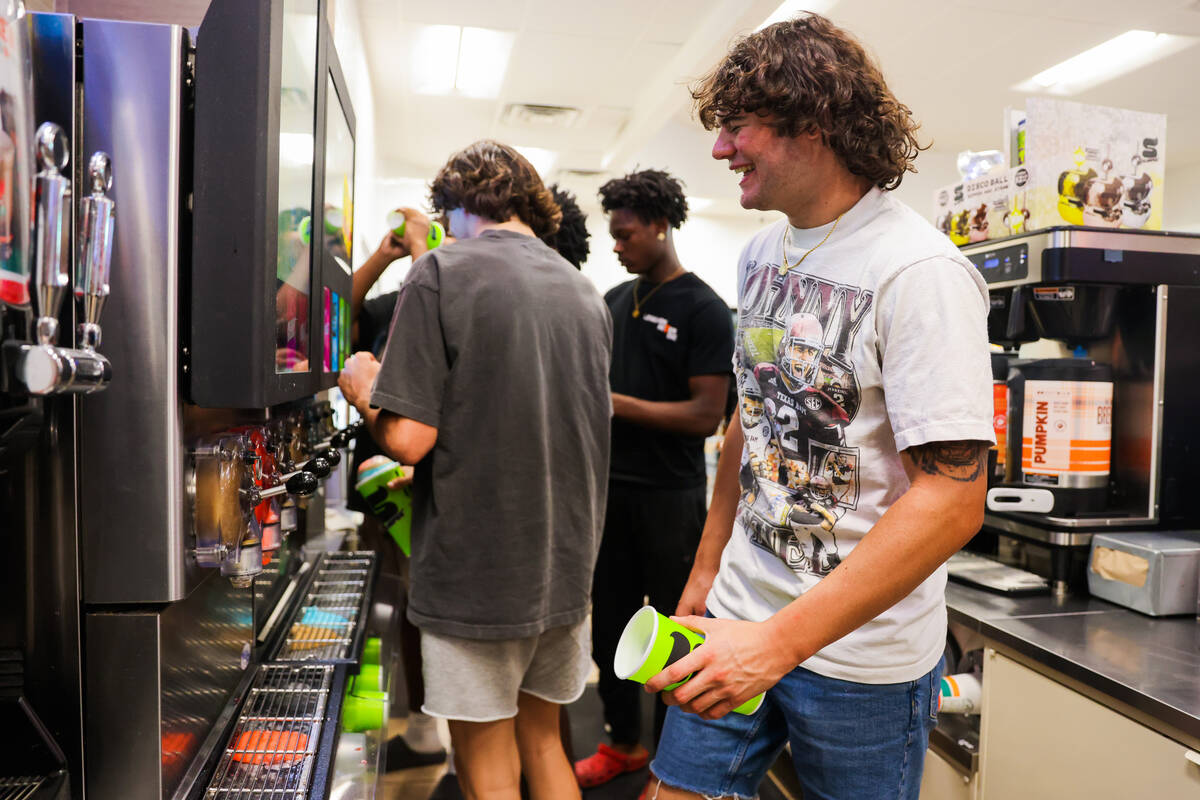 Christian Thatcher laughs as he gets slurpees with his friends at a 7/11 gas station on Wednesd ...