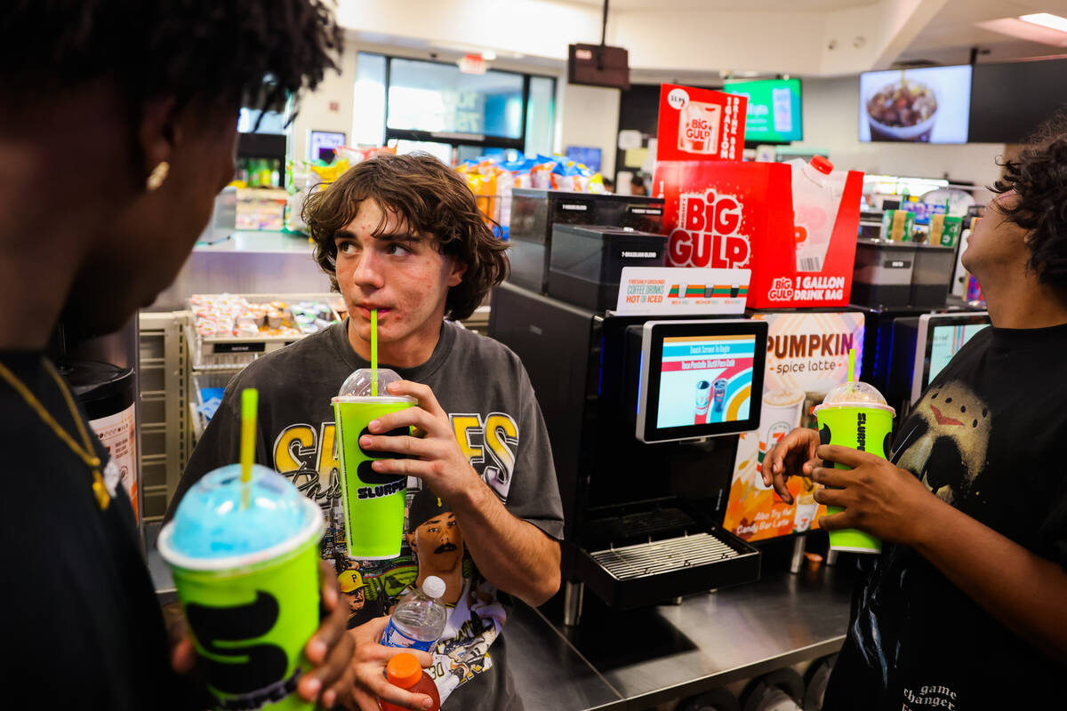 Thaddeus Thatcher gets slurpees with his friends at a 7/11 gas station on Wednesday, Sept. 11, ...