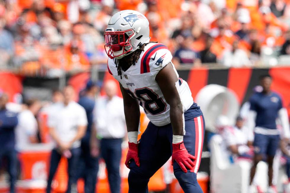 New England Patriots running back Rhamondre Stevenson (38) plays during an NFL football game ag ...