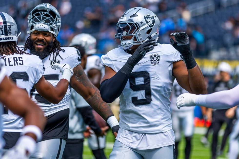 Raiders defensive end Tyree Wilson (9) looks to defensive tackle John Jenkins (95) and wide rec ...