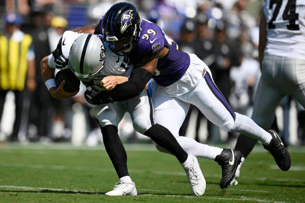 Baltimore Ravens linebacker Odafe Oweh (99) sacks Las Vegas Raiders quarterback Gardner Minshew ...