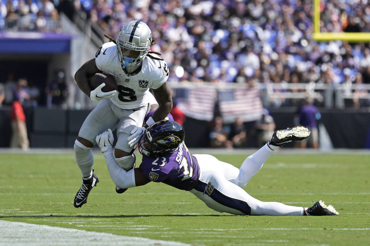 Baltimore Ravens linebacker Trenton Simpson (23) tackles Las Vegas Raiders running back Ameer A ...