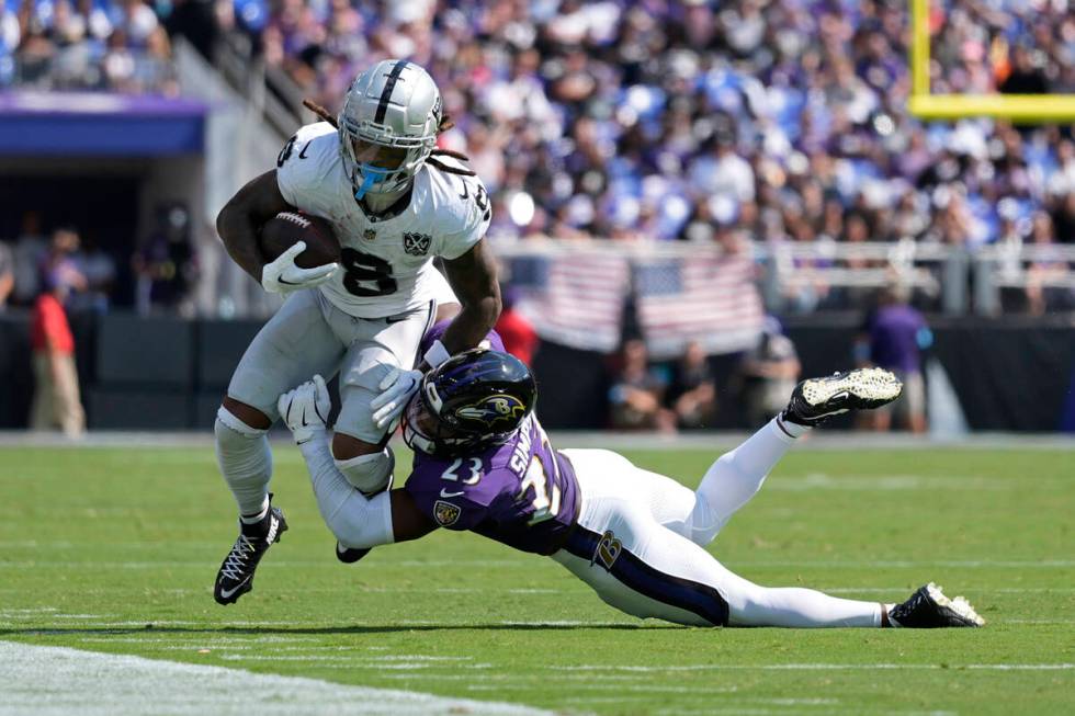 Baltimore Ravens linebacker Trenton Simpson (23) tackles Las Vegas Raiders running back Ameer A ...