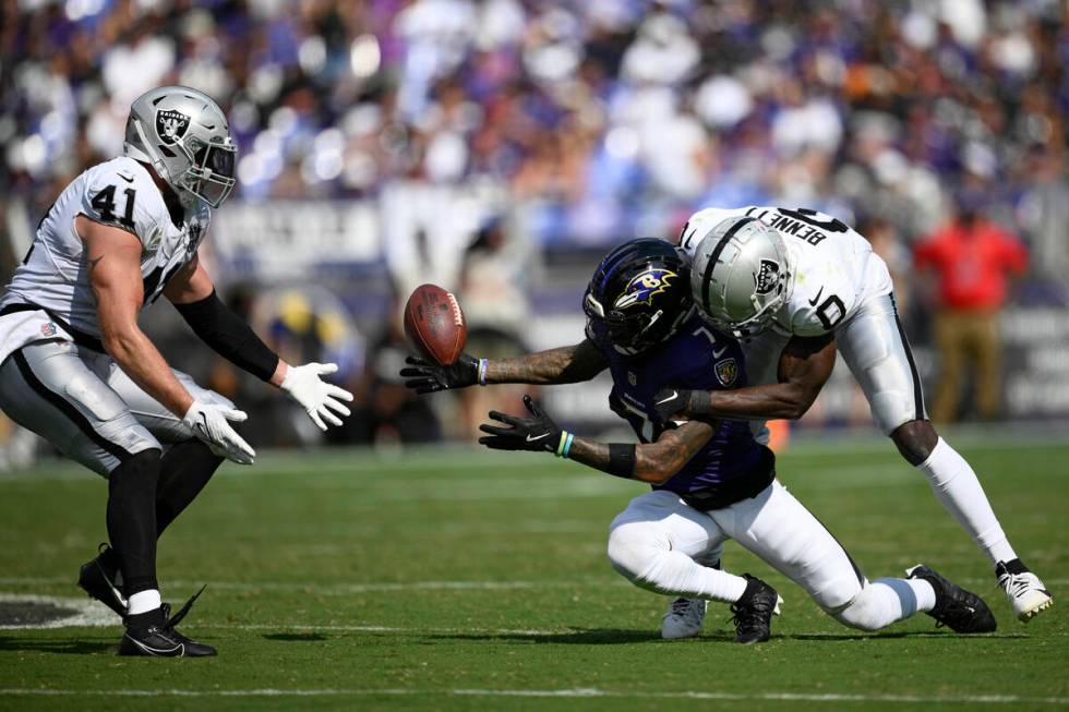 Las Vegas Raiders linebacker Robert Spillane (41) intercepts a pass intended for Baltimore Rave ...